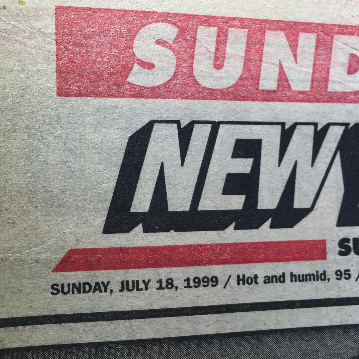 Close-up of the New York Post dated July 18, 1991, showing the date and weather details, associated with the article 'MORE TEARS' about JFK Jr.'s tragic incident.