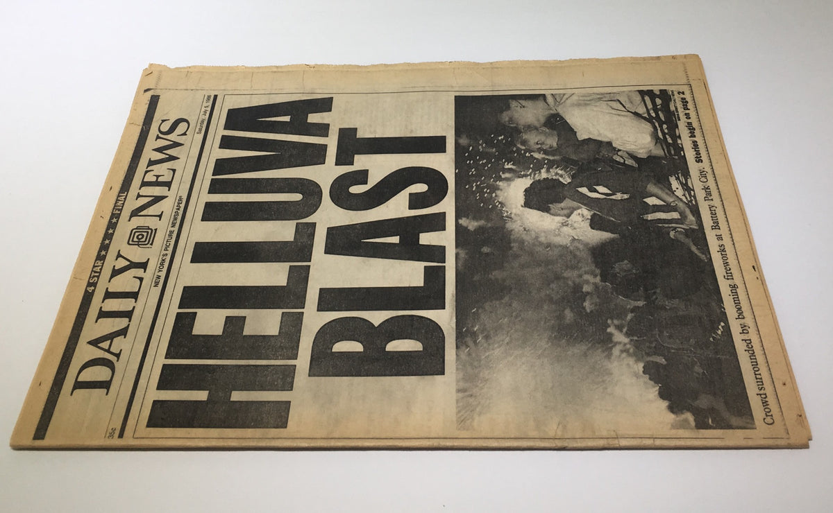 Cover of the New York Daily News, dated July 5, 1986, with the bold headline 'HELLUVA BLAST' highlighting a crowd enjoying fireworks in Battery Park City.