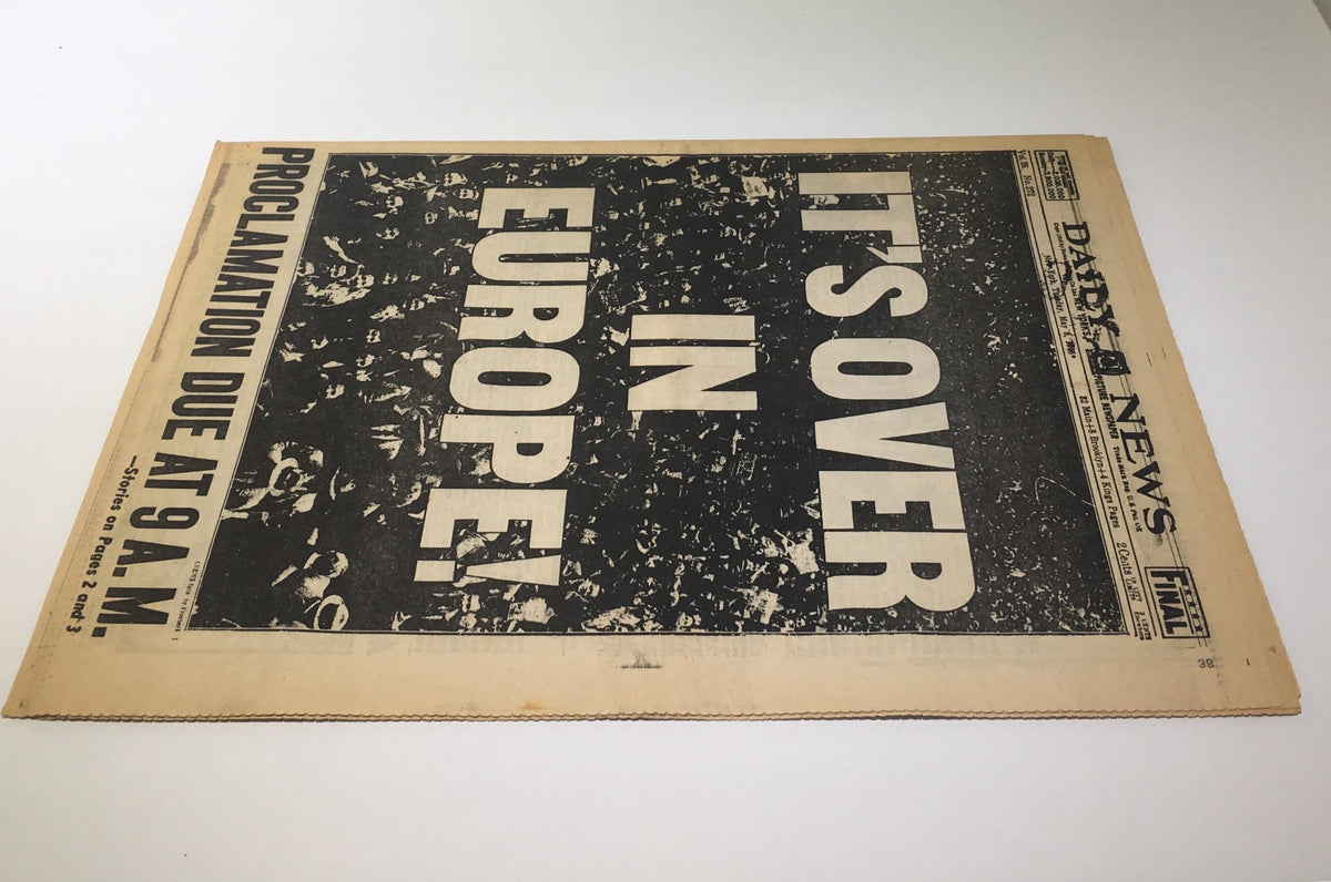 Historical newspaper front page from New York Daily News dated May 8, 1945, featuring the headline 'IT'S OVER IN EUROPE! PROCLAMATION DUE AT 9 A.M.' highlighting the end of World War II in Europe.
