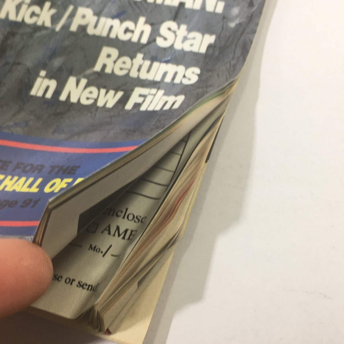 Close-up of the spine and pages of Black Belt Magazine December 1991, illustrating the magazine's condition and integrity. This historic issue features Chuck Norris on the cover, making it a valuable collectible.