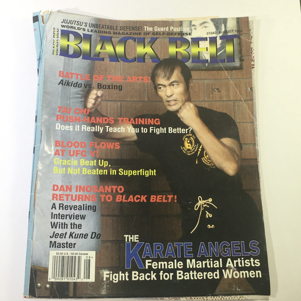 Cover of Black Belt Magazine August 1995 featuring Dan Inosanto, highlighting martial arts topics such as Aikido vs. Boxing and Royce Gracie's UFC victories.