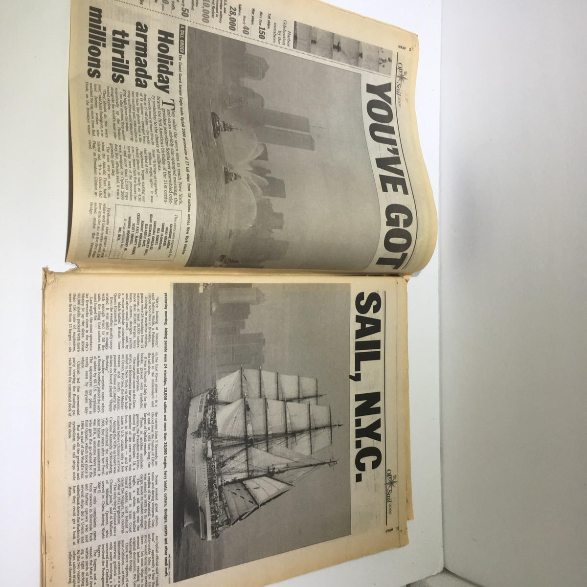 Open page of the New York Daily News showcasing a historical newspaper layout with titles and images related to NYC.