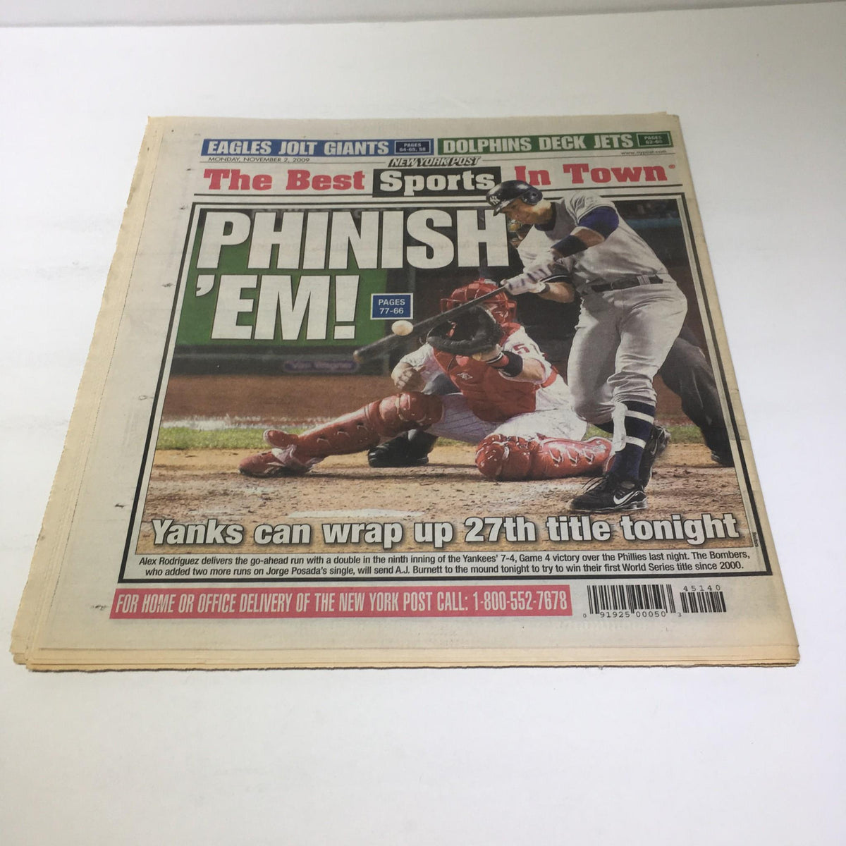 The New York Post cover titled 'PHINISH 'EM!' featuring a dramatic image of a Yankees player in action, capturing the team spirit during the 2009 World Series.