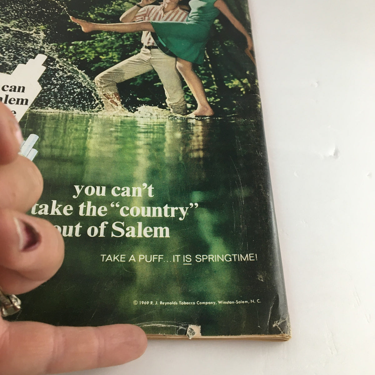 Close-up of a vintage advertisement for Salem cigarettes, showcasing a couple by water, from the Time Magazine September 19 1969 issue with Golda Meir on the cover.