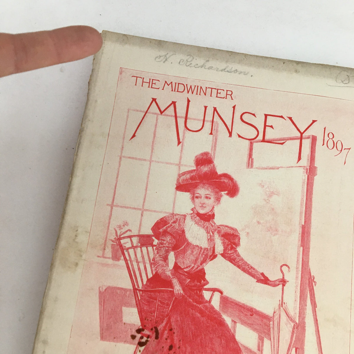 Detailed view of the cover of Munsey's Magazine Midwinter 1897 showing the magazine title and artwork, highlighting its vintage aesthetic.