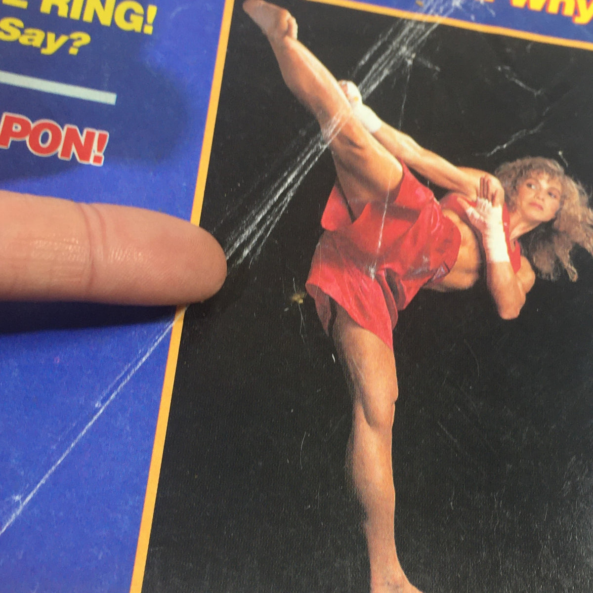 Cover image of Black Belt Magazine February 1992 featuring Kathy Long executing a high kick, showcasing her martial arts prowess. The cover reflects the magazine's focus on the Gichin Funakoshi story and martial arts culture.