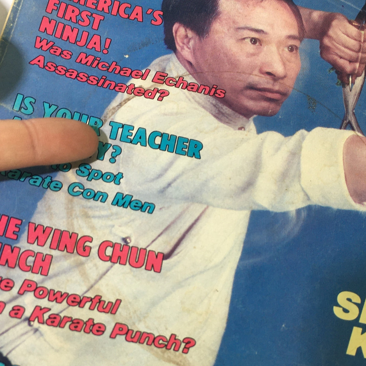 Close-up of the Black Belt Magazine cover from August 1988 highlighting the title 'Is Your Teacher a Phony?' and featuring Michael Enchanis.