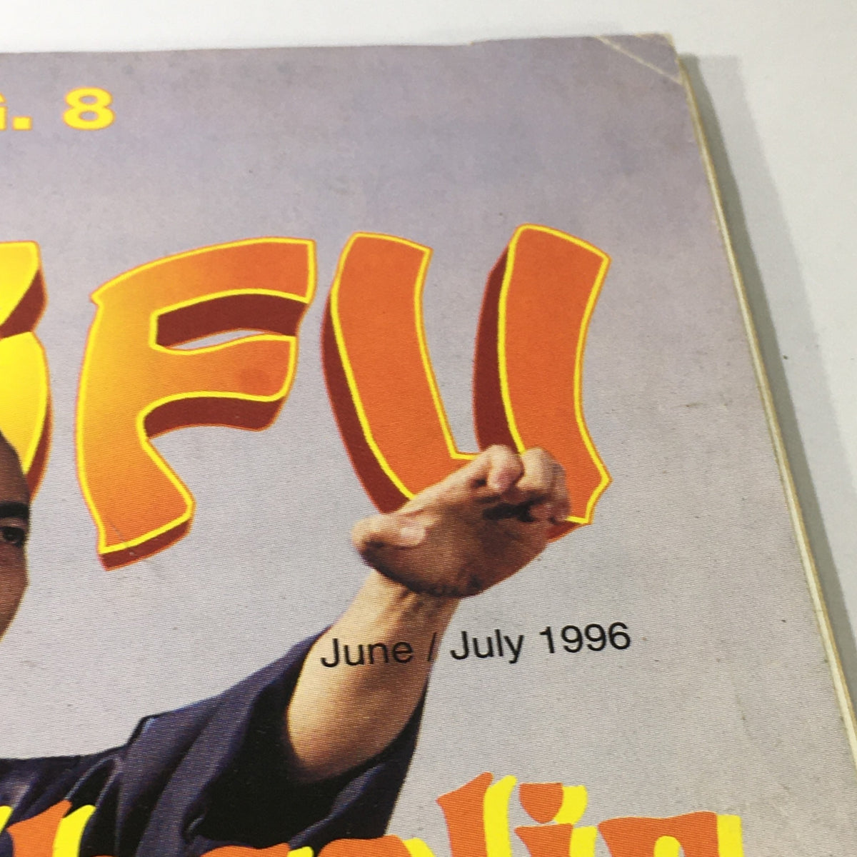 Cover image of Wushu Qigong Kung Fu Magazine June July 1996 featuring bold lettering and an illustration of martial arts.
