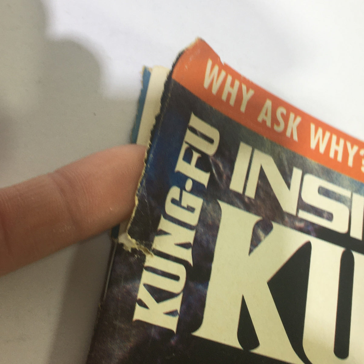 Close-up of the damaged edge of Inside Kung Fu Magazine May 1994, showcasing wear typical for vintage magazines.