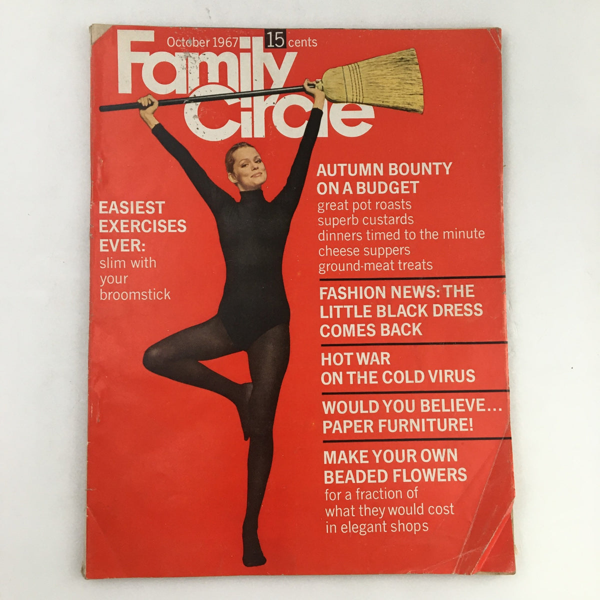Cover of Family Circle Magazine October 1967 featuring a model in a black outfit holding a broom, showcasing the theme 'The Little Black Dress Comes Back'.
