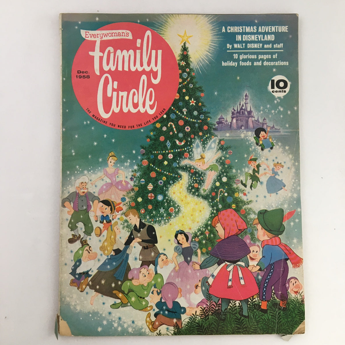 Family Circle Magazine December 1958 cover featuring a Christmas adventure theme at Disneyland, showcasing a large decorated Christmas tree with characters and festive illustrations.
