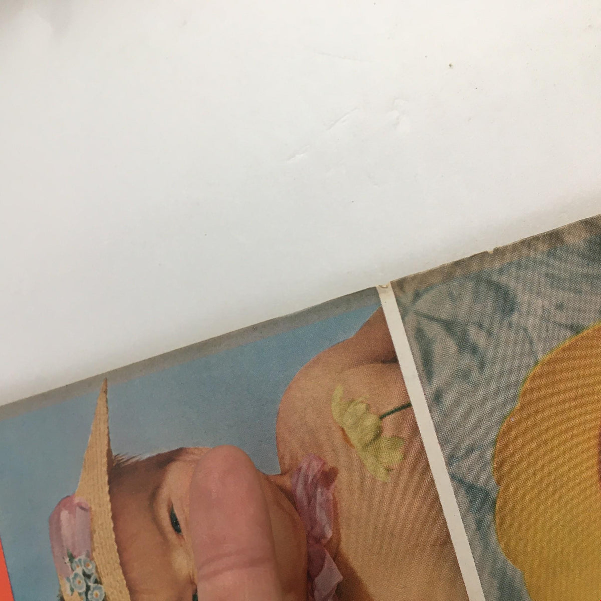 Close-up of Family Circle Magazine May 1951 cover, highlighting a smiling baby wearing a straw hat adorned with a flower. The image captures the nostalgic essence of vintage baby photography.