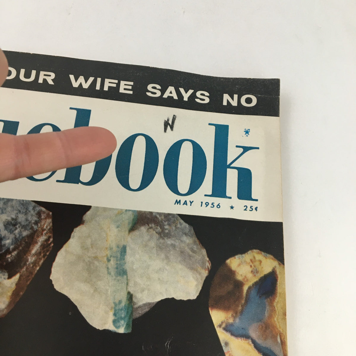 Cover of Bluebook Magazine from May 1956 featuring colorful stones and the text 'YOUR WIFE SAYS NO', showcasing vintage magazine aesthetics and culture.