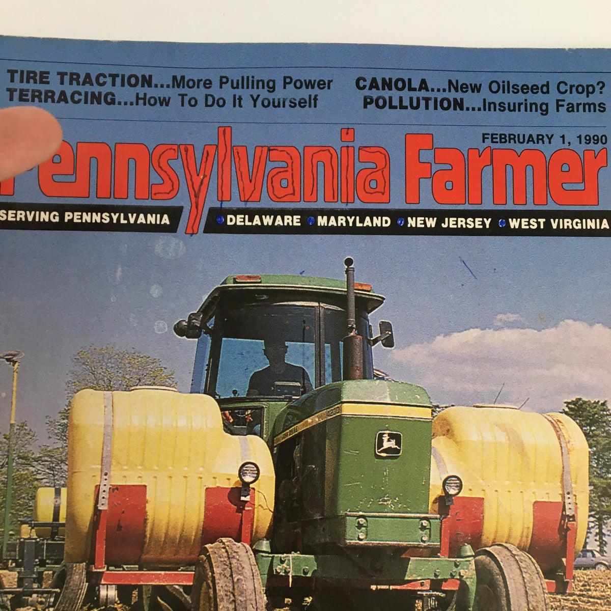 Close-up of Pennsylvania Farmer Magazine cover, February 1, 1990, showcasing the headlines 'Tire Traction,' 'Terracing,' and 'Pollution' along with a green tractor, emphasizing 'Ridge-Till Planting' as a farming option.