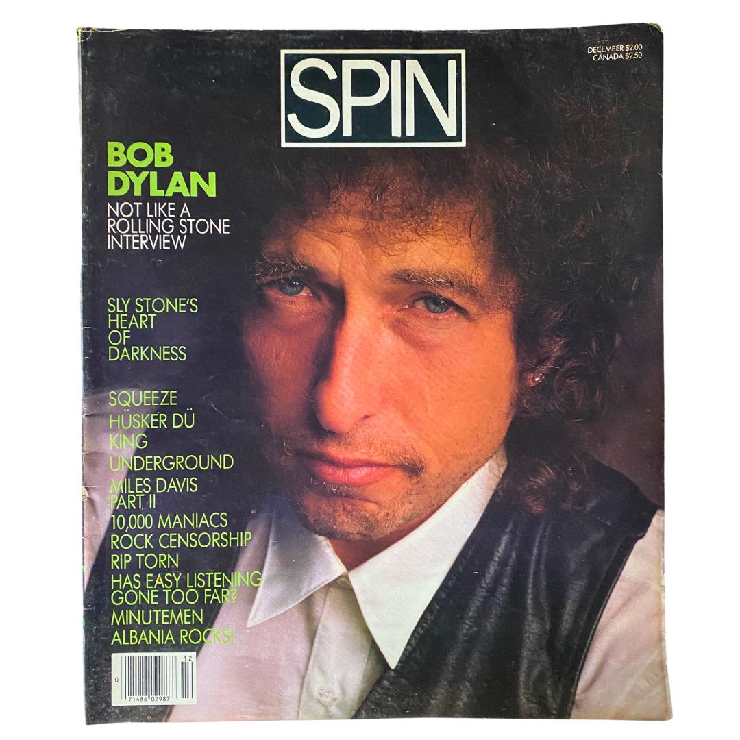 Cover of VTG Spin Magazine December 1985 Vol 1 No. 8 featuring Bob Dylan with a close-up shot and bold text elements highlighting the interview and other artists.