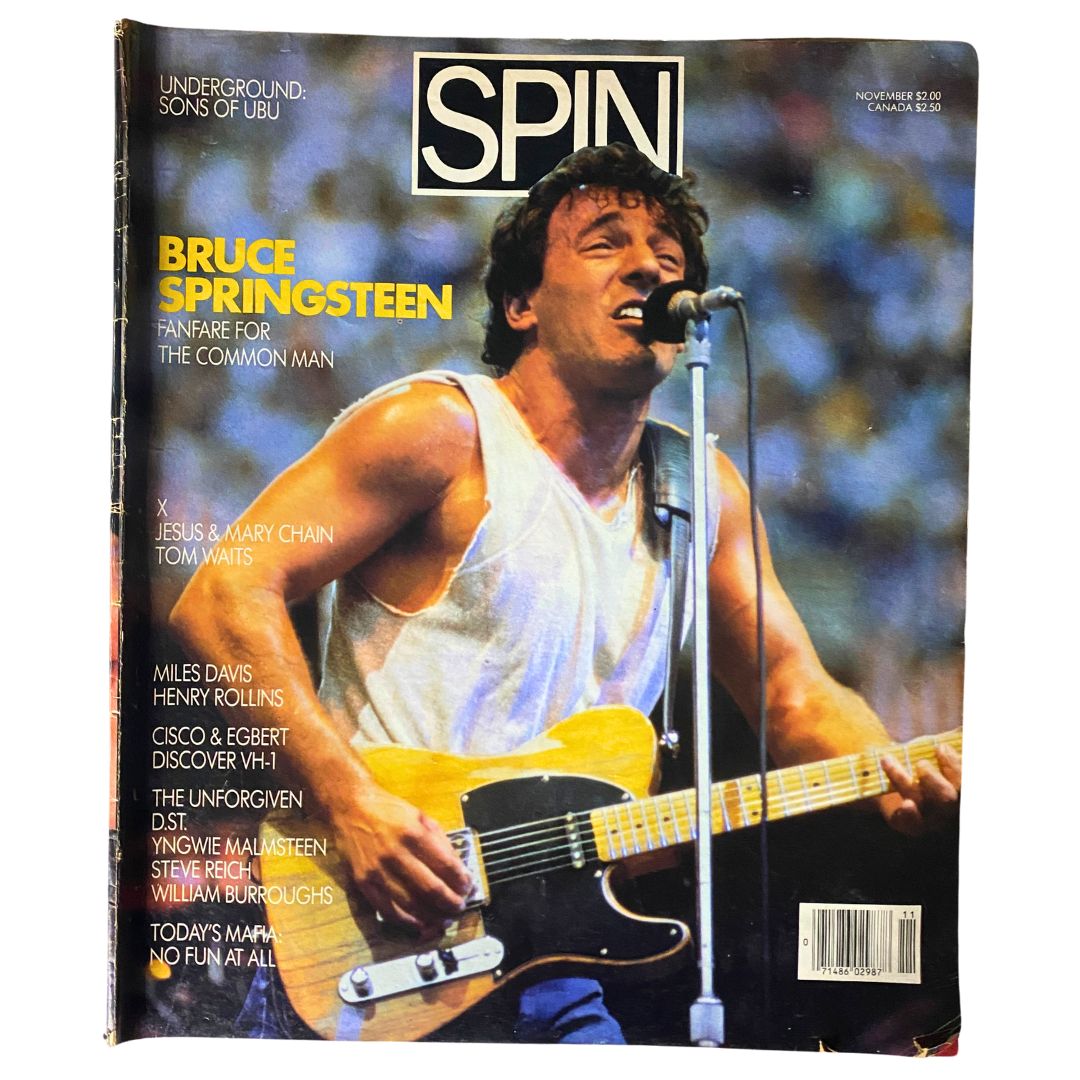Cover of Spin Magazine November 1985 featuring Bruce Springsteen on stage. The magazine showcases Volume 1, Number 7, highlighting Springsteen’s influence in the music industry during the 1980s.