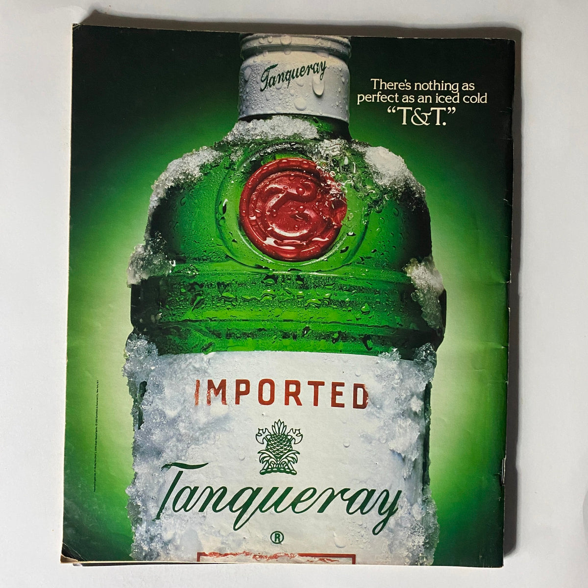 Vintage advertisement of Tanqueray gin showcasing an iced cold bottle with condensation, featured in Spin Magazine October 1992 Vol 8 No. 7.