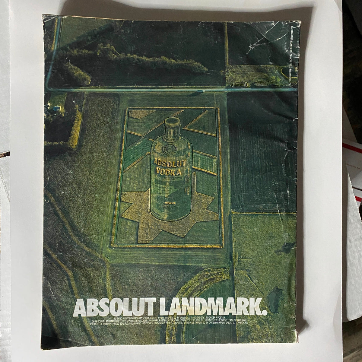Vintage Interview Magazine November 1991 featuring Keanu Reeves and River Phoenix with an eye-catching cover design, showcasing a unique aerial view of an Absolut Vodka advertisement on a landscape, perfect for collectors and fans of cinema history.