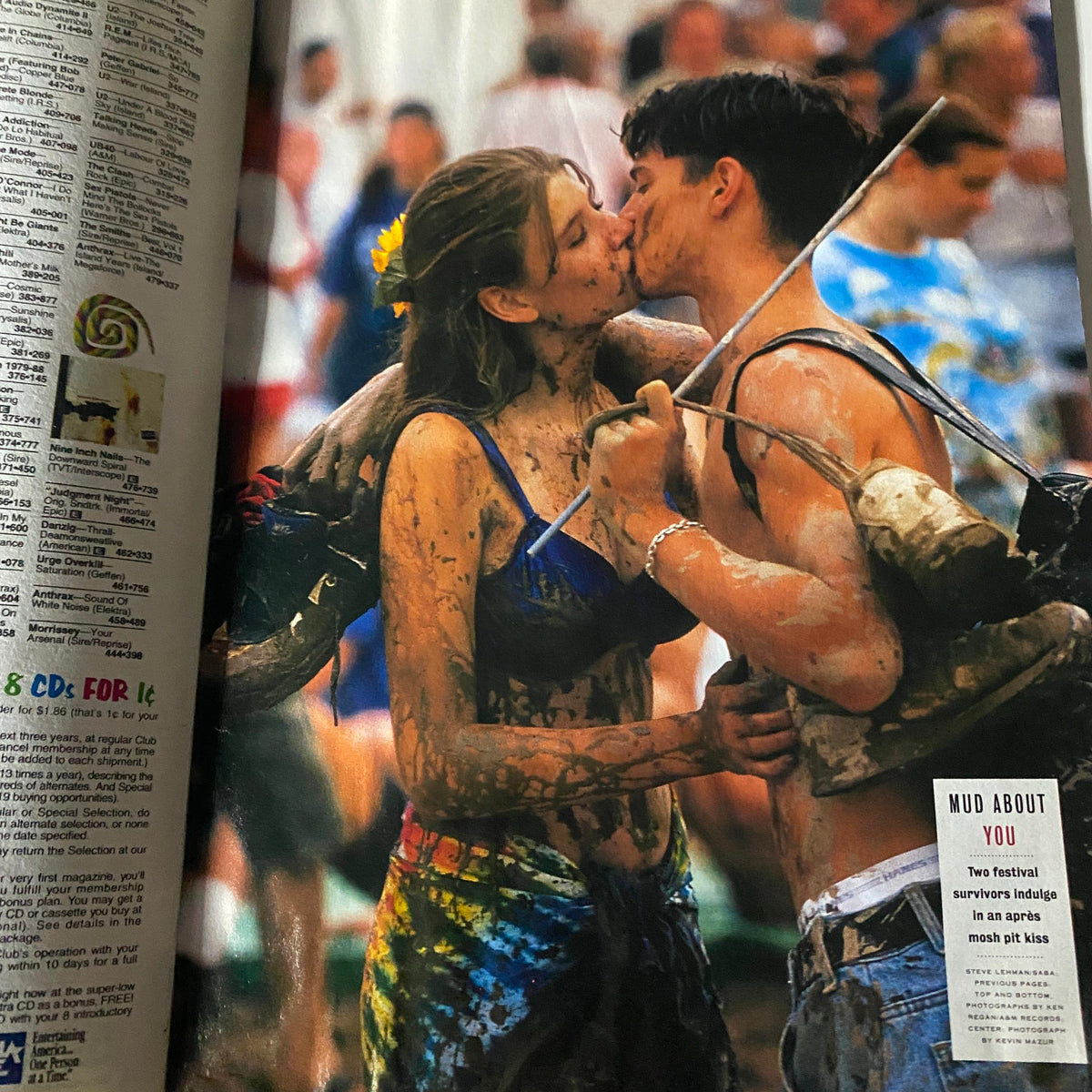 Inside page of Entertainment Magazine September 30 1994 showing a couple kissing in the mud at Woodstock '94, highlighting the festival's playful and romantic spirit.