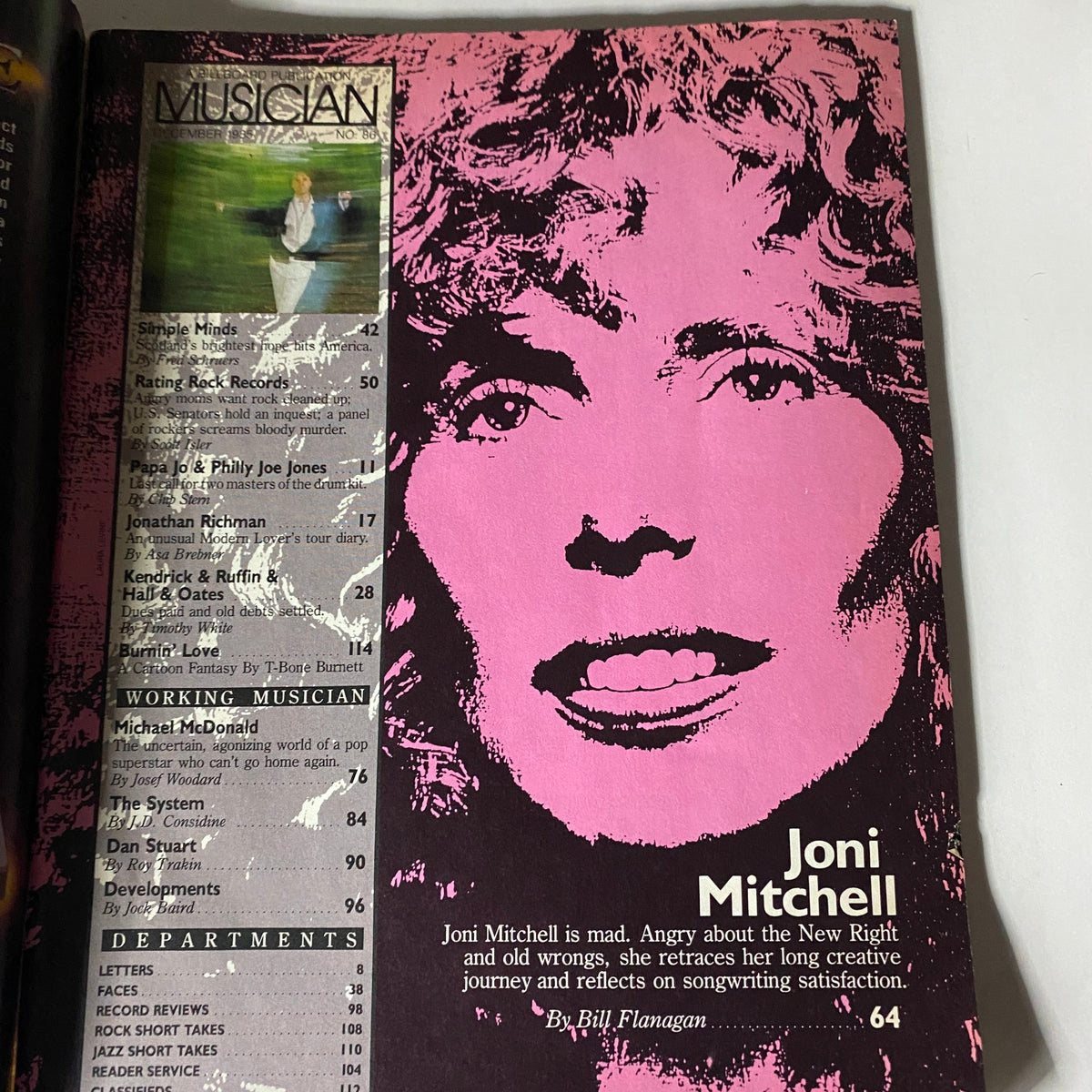 Inside page of VTG Musician Magazine December 1985 featuring an article about Joni Mitchell, highlighting her music journey with a distinct pink design.
