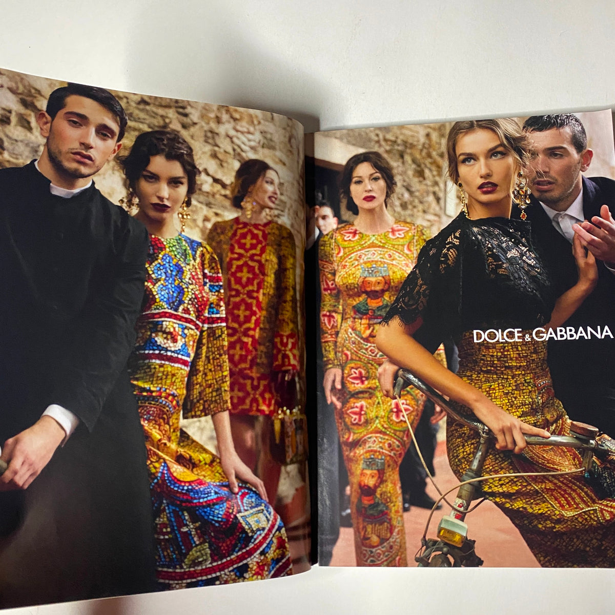 Vogue Magazine August 2013 spread featuring a vibrant advertisement for Dolce & Gabbana, showcasing bold fashion designs amidst a cultural backdrop.
