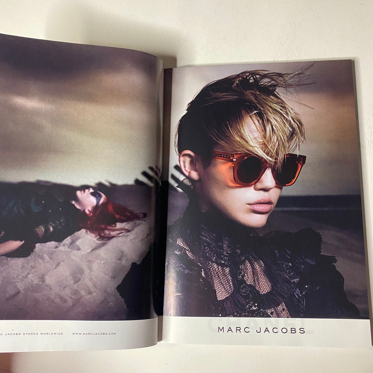 Fashion editorial from Vogue Magazine June 2014 displaying a model in Marc Jacobs sunglasses, emphasizing modern chic styles.