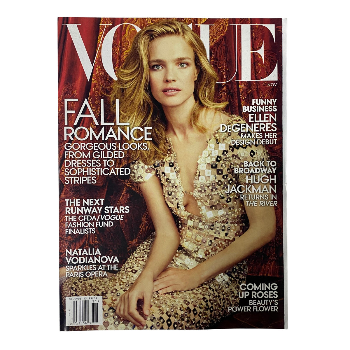 Vogue Magazine November 2014 featuring Natalia Vodianova on the cover, highlighting 'Fall Romance' fashion styles with intricate designs and elegance.