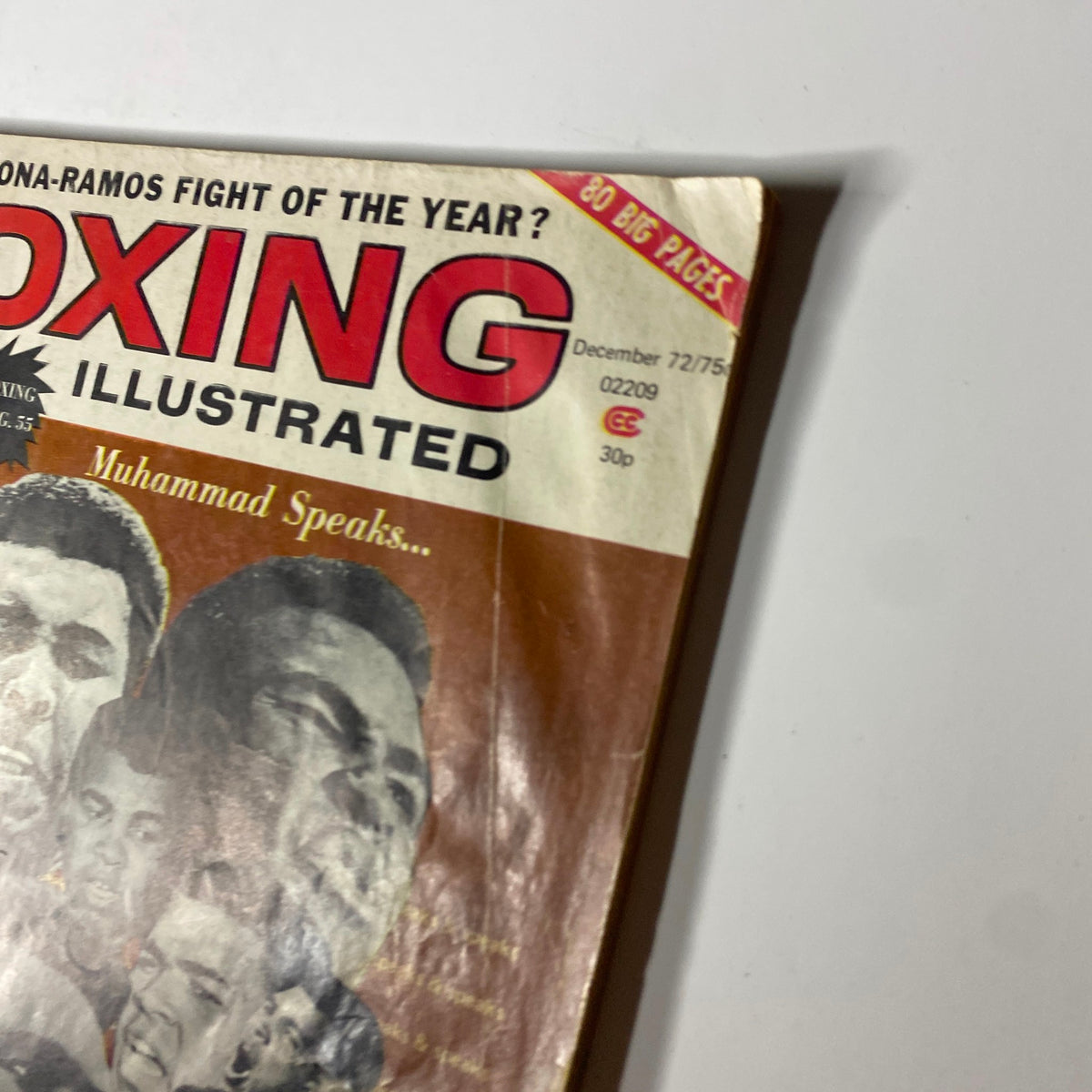 Close-up view of the Boxing Illustrated Magazine December 1972 cover showing Muhammad Ali. The magazine's title and the issue date are prominently displayed.