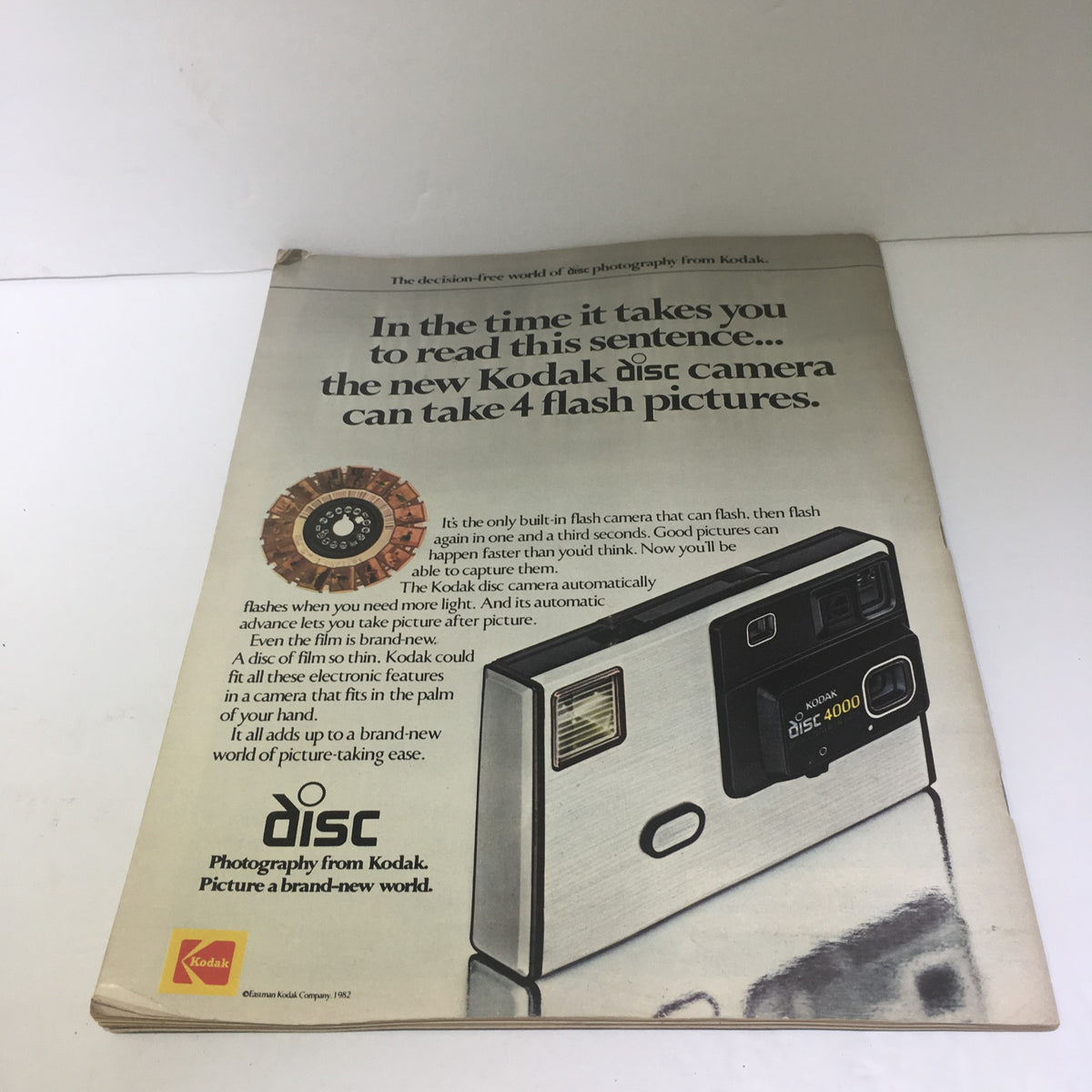 Retro advertisement for a Kodak disc camera featured in Life Magazine: Liver Transplants - Dustin Hoffman - September 1982, showcasing the camera and its features.