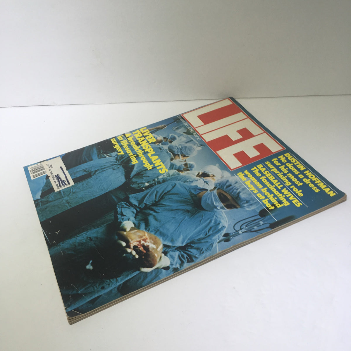 September 1982 issue of Life Magazine featuring liver transplants on the cover, showcasing medical professionals in surgical attire with a liver organ, a collectible publication highlighting advancements in medicine and a feature on actor Dustin Hoffman.