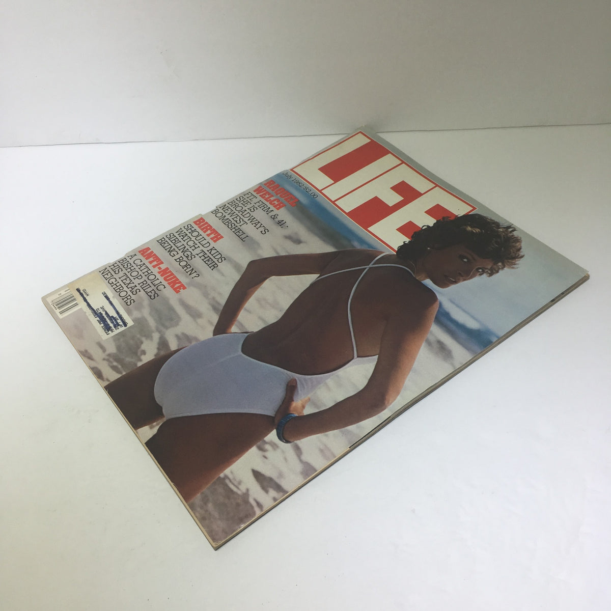 Life Magazine July 1982 featuring Raquel Welch on the cover, showcasing vintage Hollywood glamour with a striking image of Raquel in a swimsuit on the beach.
