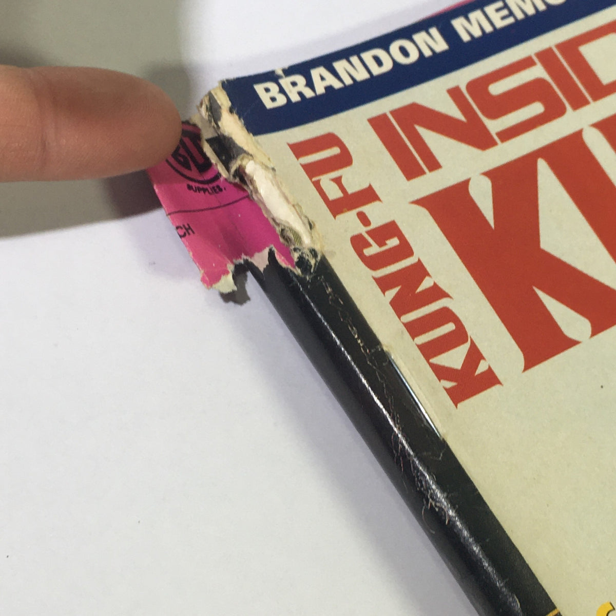 Close-up of the spine of Inside Kung Fu Magazine April 1995 showing minor wear and tear, highlighting its vintage condition.