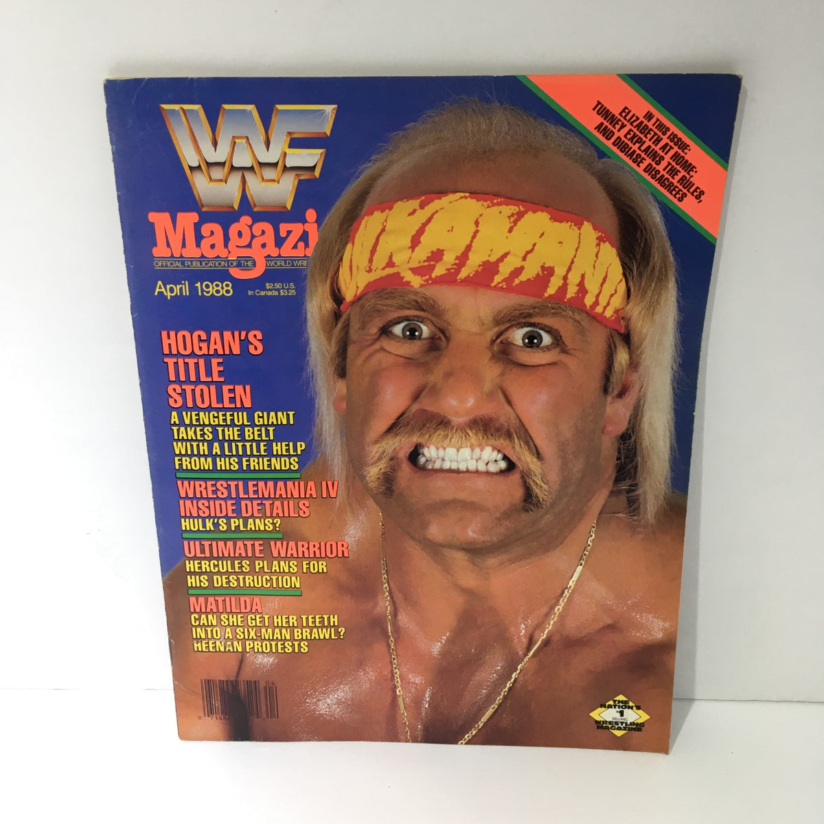 Cover of WWF Magazine, April 1988, featuring the title 'Hogan's Title Stolen - Wrestle Mania IV Inside Details' with an intense image of a wrestler in a headband and a fierce expression.