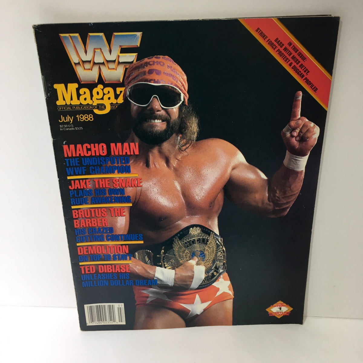 WWF Magazine featuring Macho Man - Undisputed WWF Champion, July 1988. The cover showcases Randy 'Macho Man' Savage wearing his iconic headband and sunglasses, displaying the championship belt, encapsulating the vibrant energy of professional wrestling in the late 1980s.