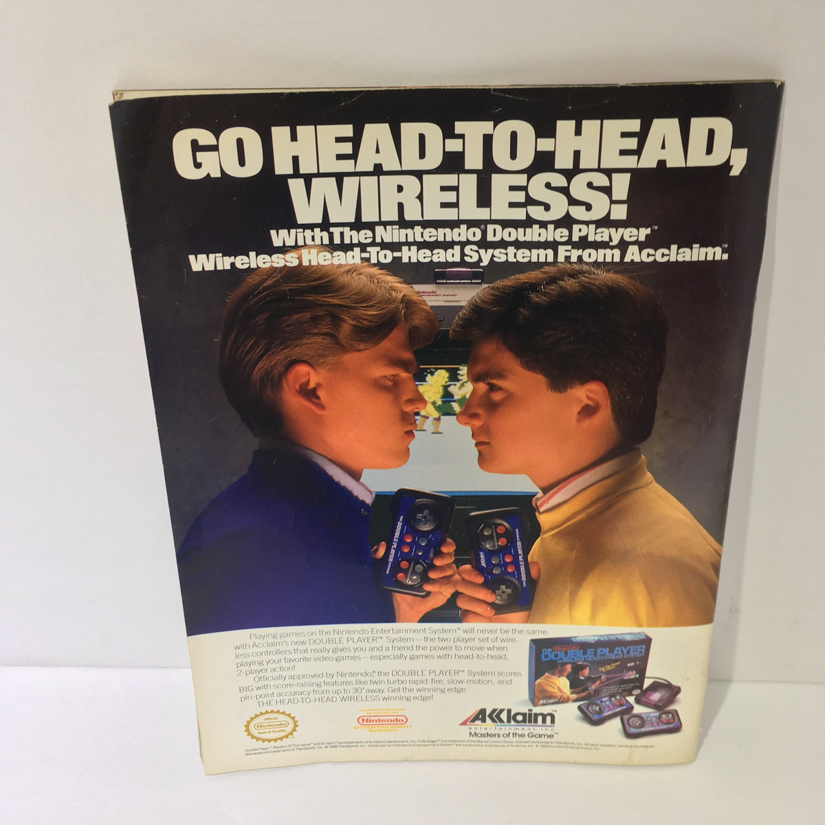 Back cover of WWF Magazine showcasing a nostalgic advertisement for the Nintendo Double Player system, emphasizing wireless gaming features.