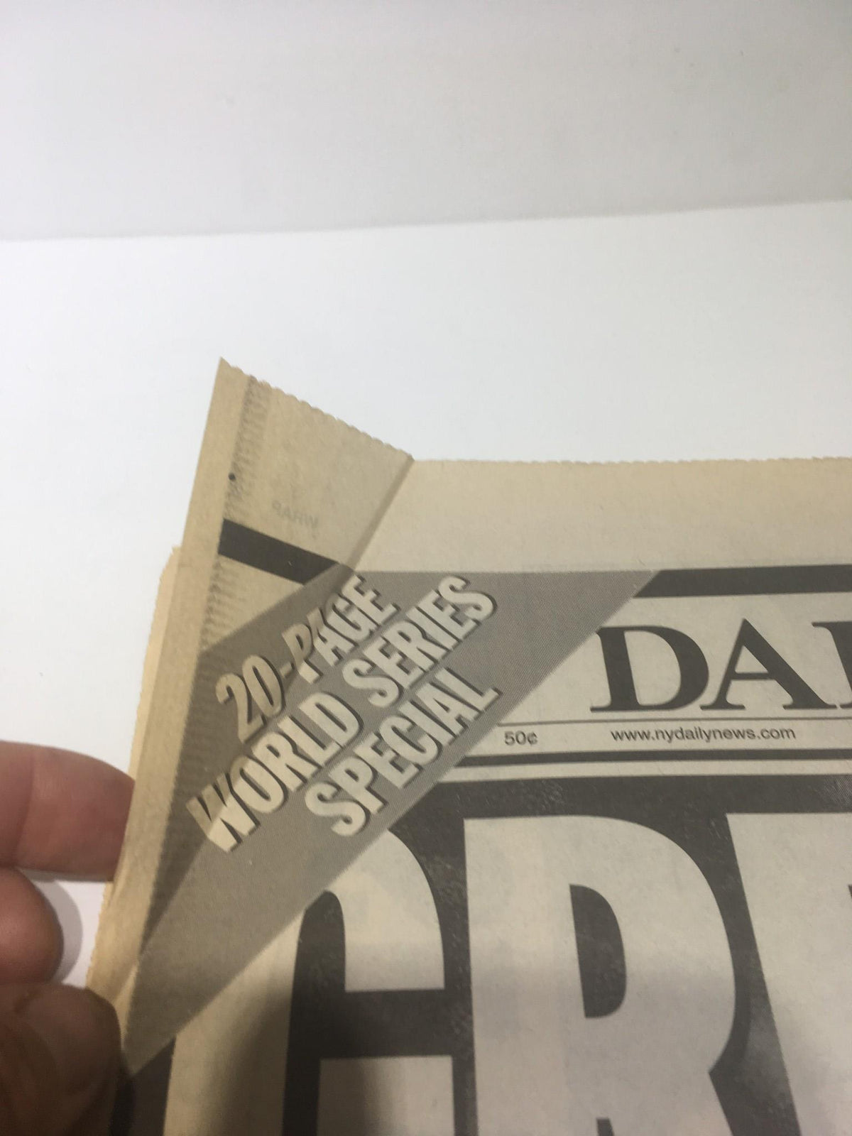 Image features the corner of the New York Daily News from October 22, 1998, highlighting the 20-page World Series special edition covering the Yankees' sweep of the Padres.