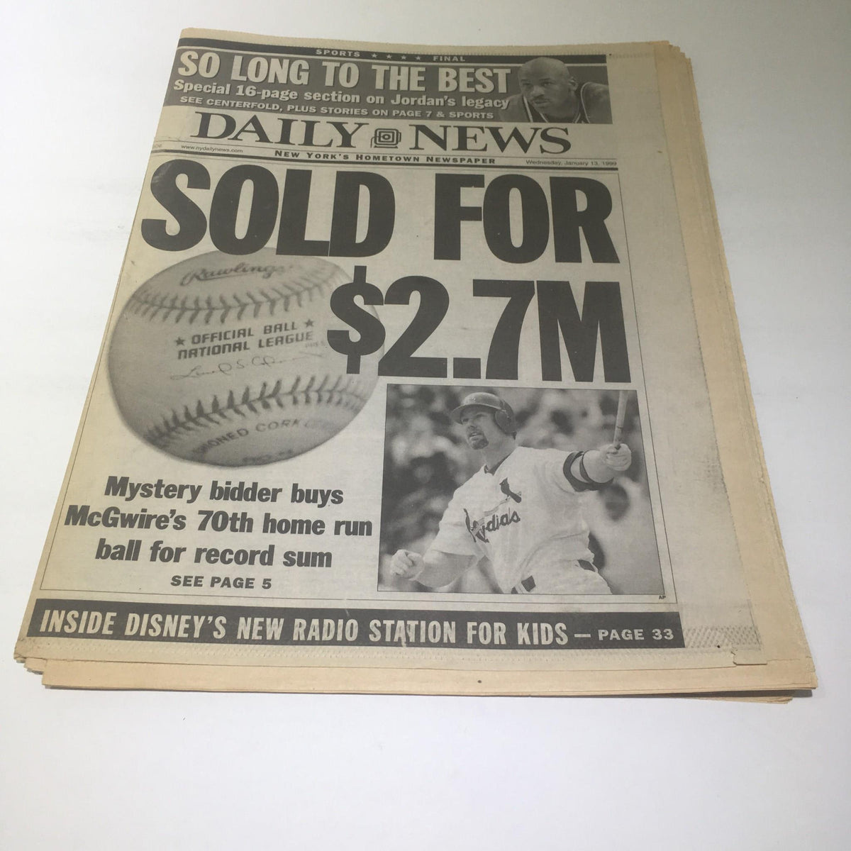 NY Daily News front page featuring the headline 'SOLD FOR $2.7M,' reporting on the sale of McGwire's 70th home run ball.