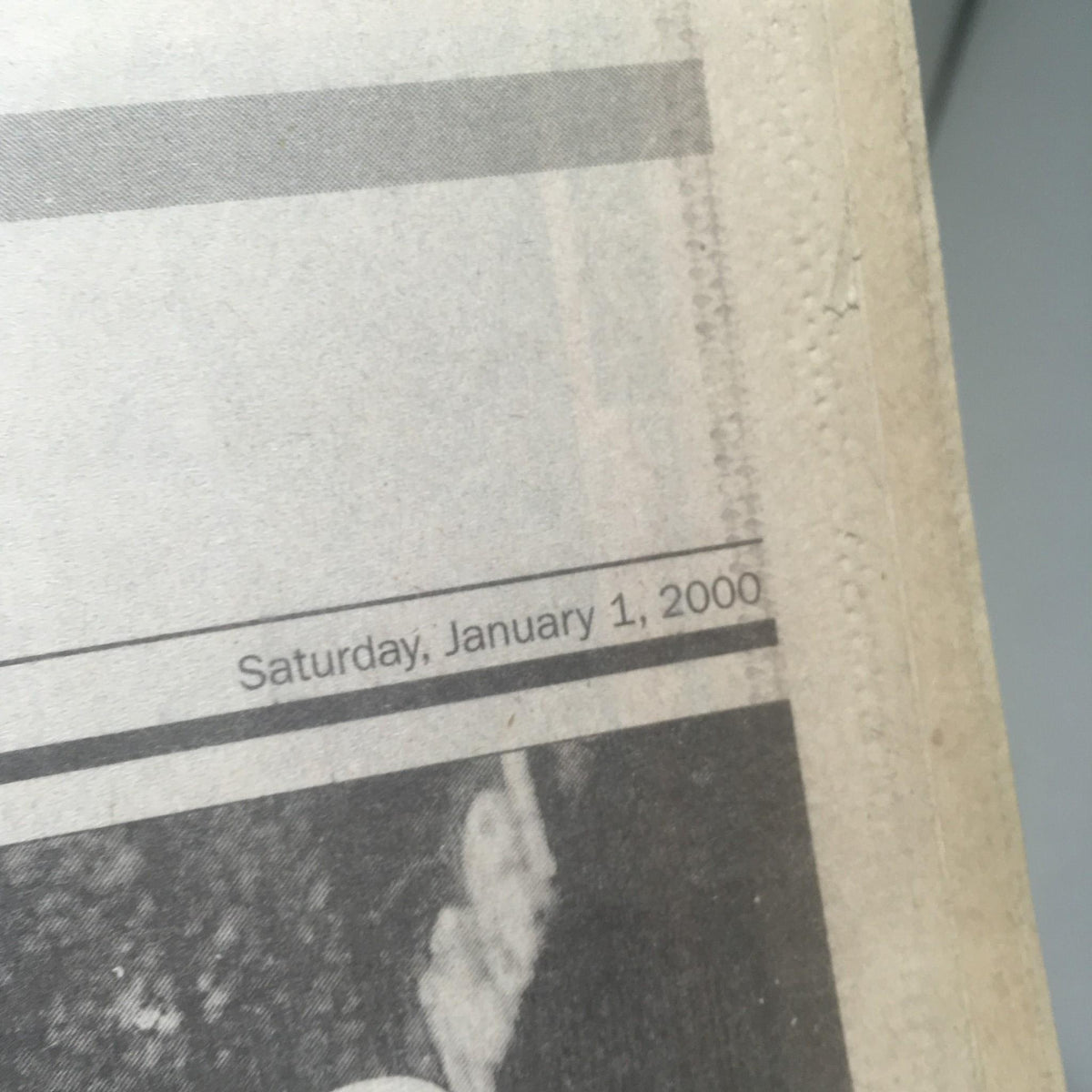 Close-up of the NY Daily News dated Saturday, January 1, 2000, highlighting the historical significance of the publication.