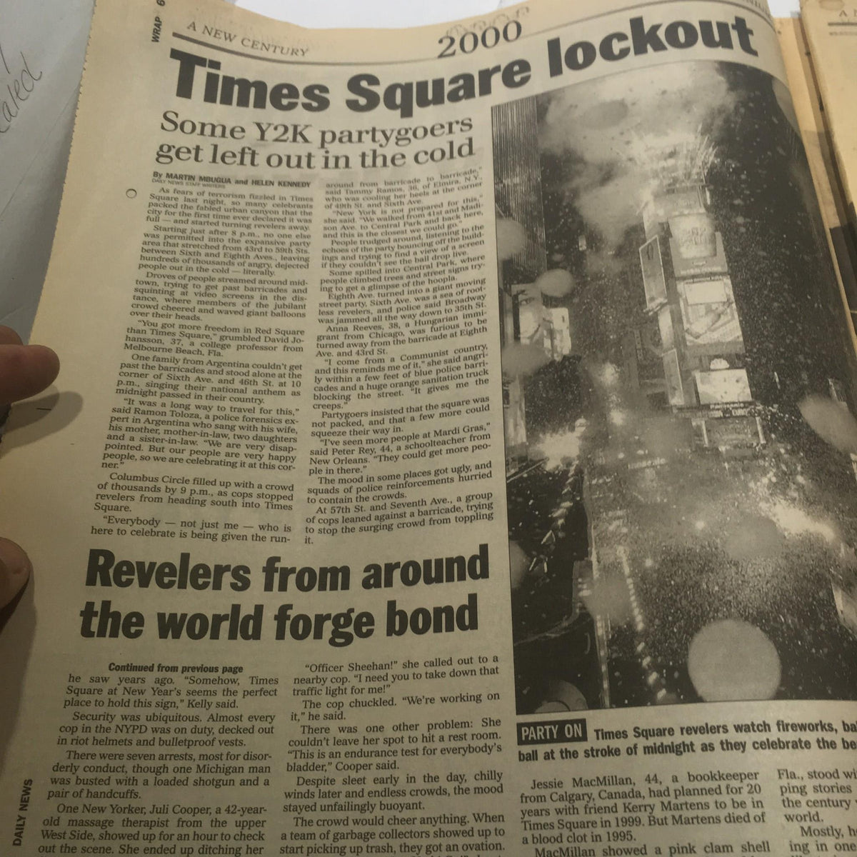 Inside page of the NY Daily News from 1/1/2000, featuring an article on the Times Square lockout during the New Year celebration, commemorating the largest peacetime crowd in Times Square.