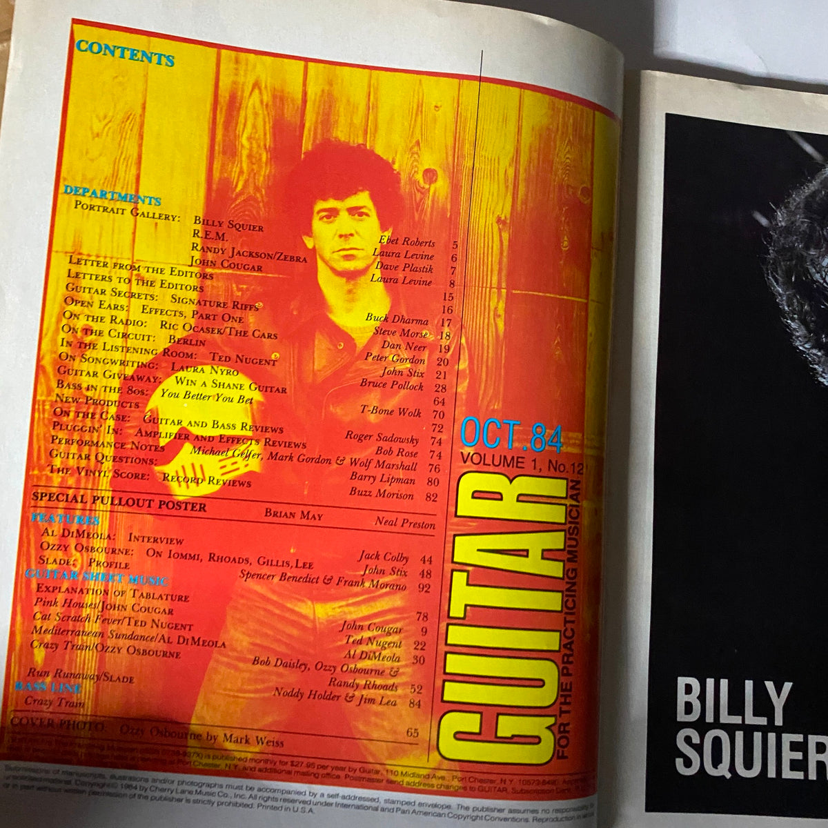 Inside pages of the Vintage Guitar Magazine October 1984 showing the contents section with notable articles and a pullout poster featuring Brian May.