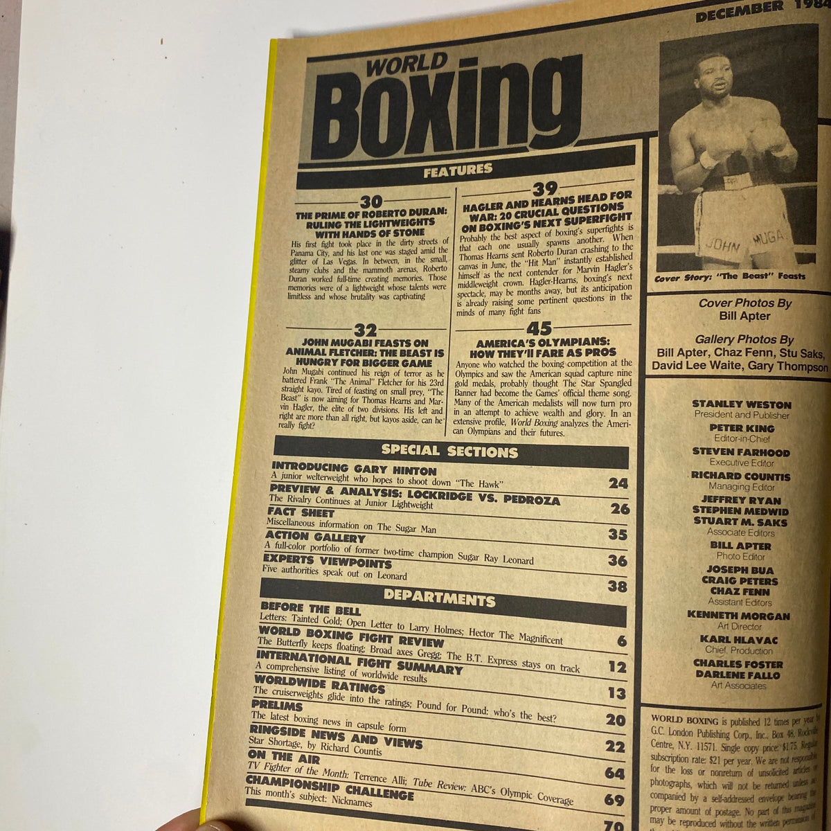 Table of contents from World Boxing Magazine December 1984 featuring John Mugabi on the cover. Highlights include features on Roberto Duran, John Mugabi, and critical boxing match-ups of the era.