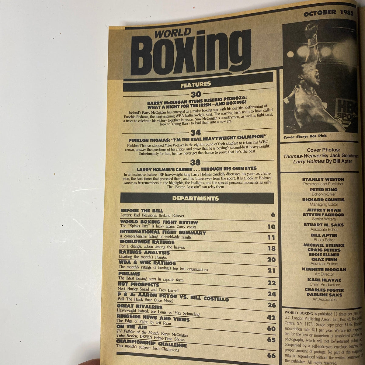 Table of contents from World Boxing Magazine, October 1985, listing features including Barry McGuigan's fight review and Larry Holmes's career retrospective.