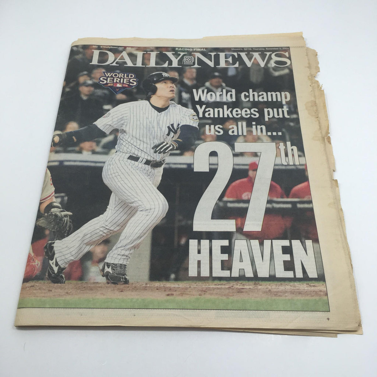 Front page of New York Daily News, November 5, 2009 issue featuring the headline 'World Champ Yankees Put Us All in 27th Heaven' with a player in a Yankees uniform during a game.