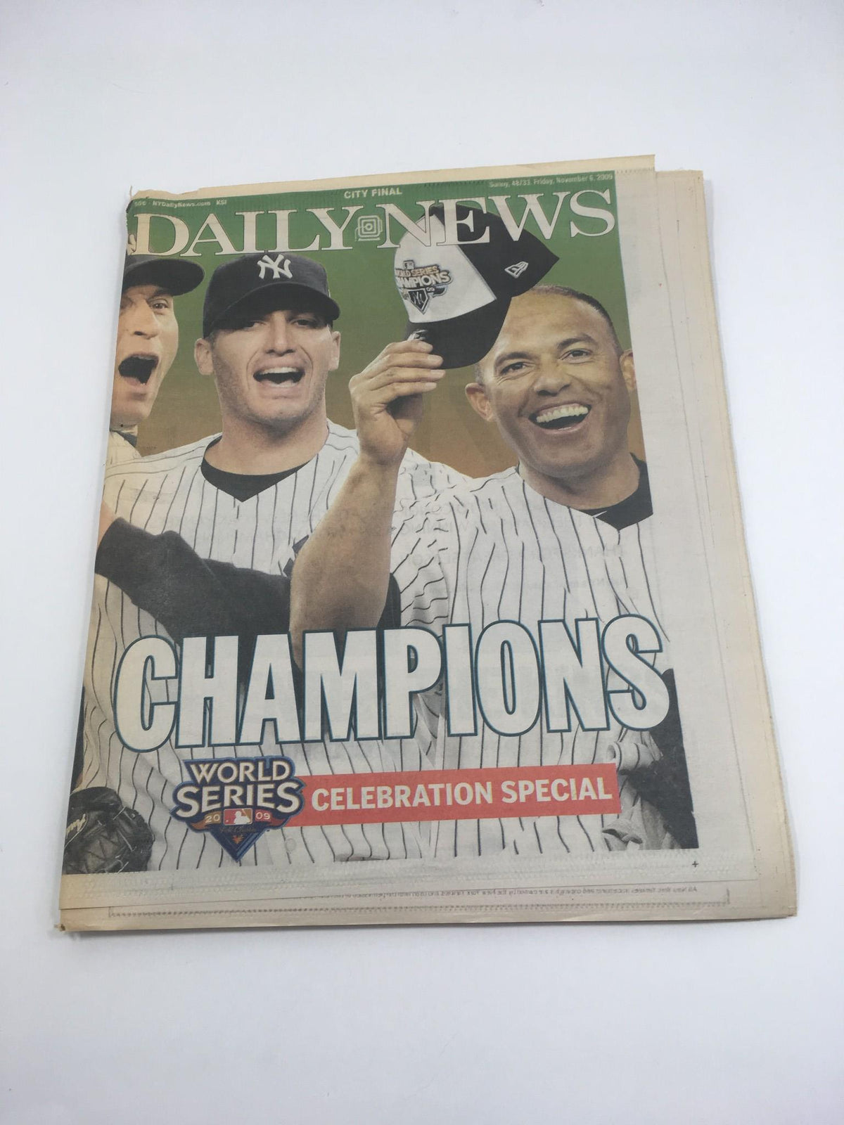 New York Daily News: Nov 6 2009, World Series Champions Celebration Special cover featuring happy players in Yankees uniforms celebrating with a championship cap.
