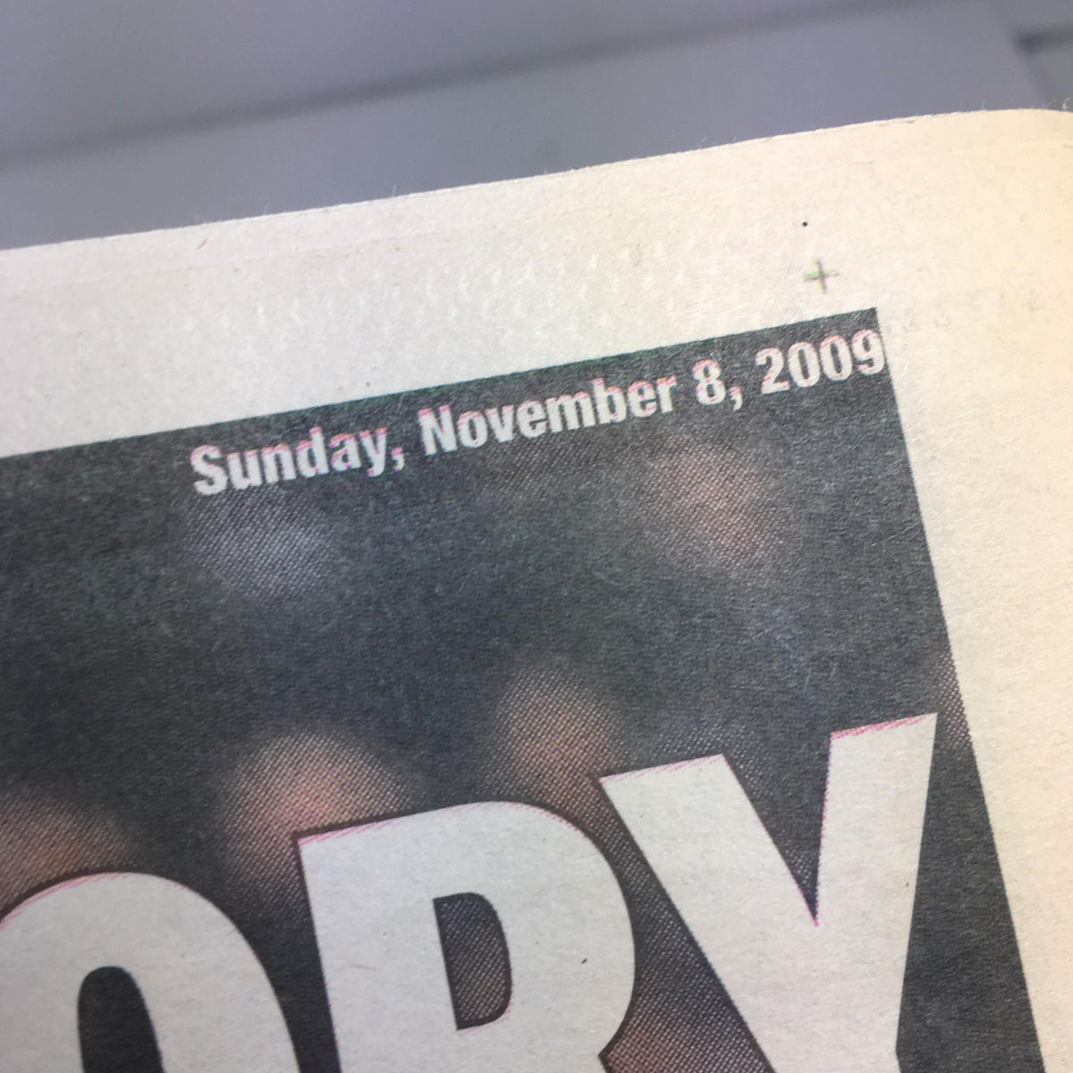 Close-up of the NY Daily News publication date, showing 'Sunday, November 8, 2009' at the top of the front page of 'Road to Glory' commemorative issue.