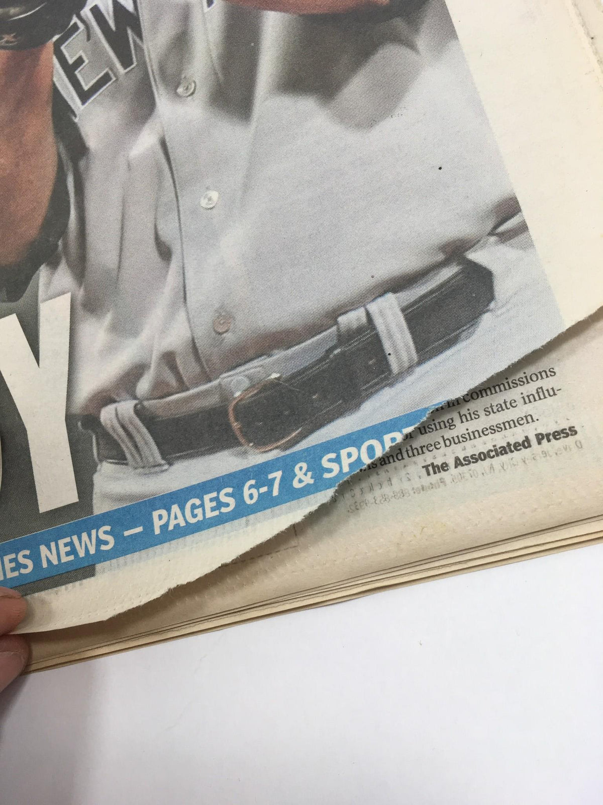 Close-up of a baseball player's belt on the New York Daily News front page, dated October 31, 2009, beneath the headline 'Hey Andy, Be Dandy'.