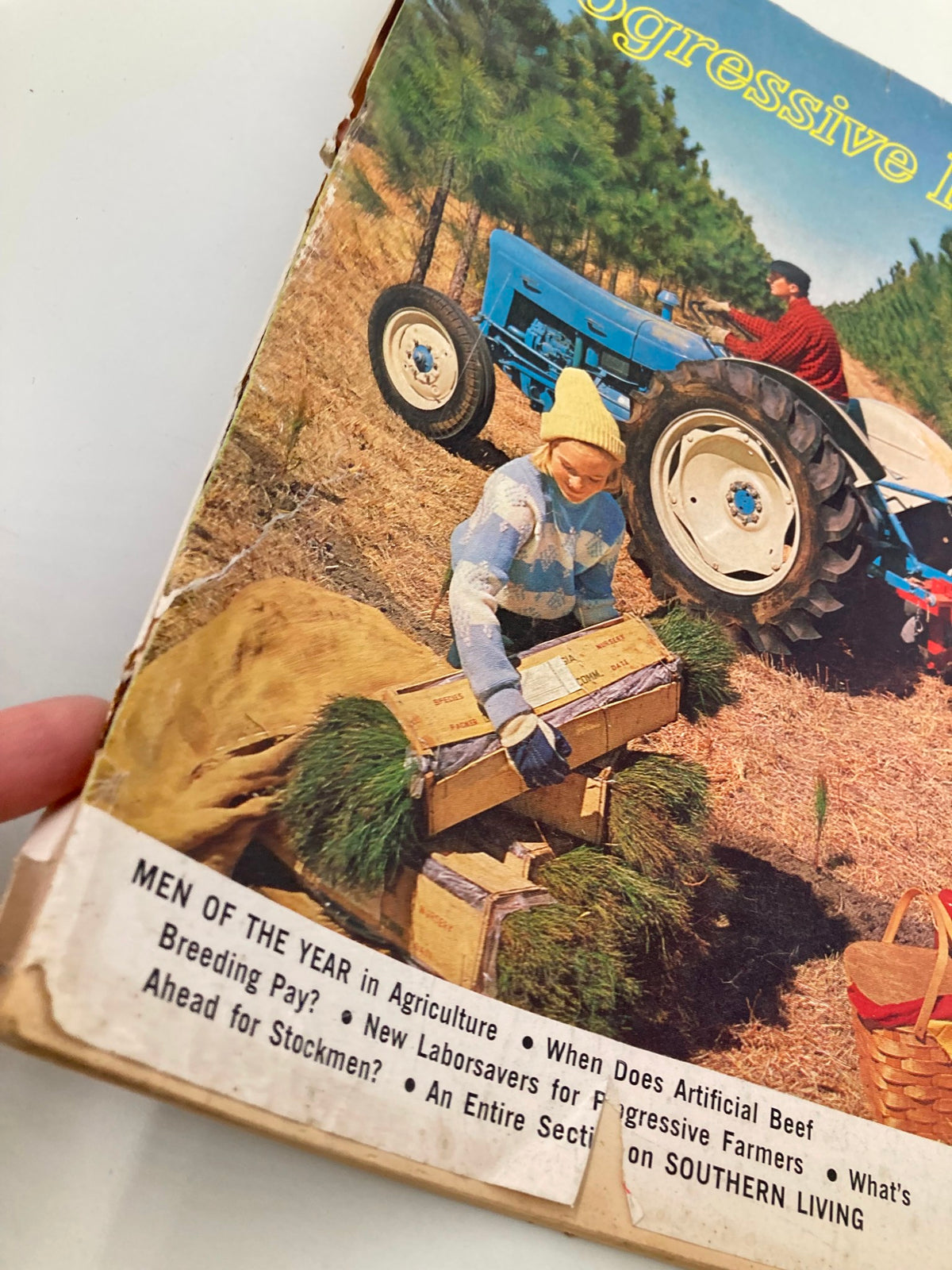 Vintage cover of The Progressive Farmer Magazine January 1964 featuring a rural agricultural scene with a tractor and workers. This collectible magazine highlights the agricultural advancements of the 1960s.