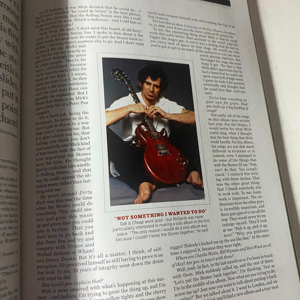 An article page from the Rolling Stone Magazine September 2013 featuring Keith Richards with a guitar, detailing insights into The Rolling Stones.