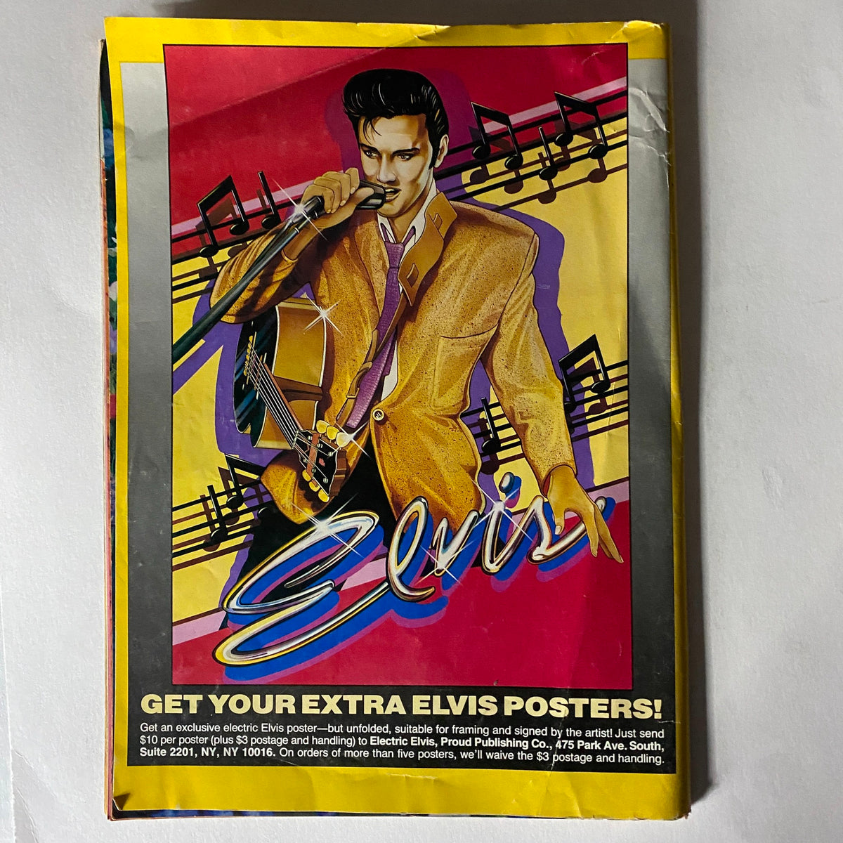 Elvis Lives On Magazine July 1992 featuring a colorful advertisement for extra Elvis posters, depicting an artistic illustration of Elvis Presley performing with musical elements.