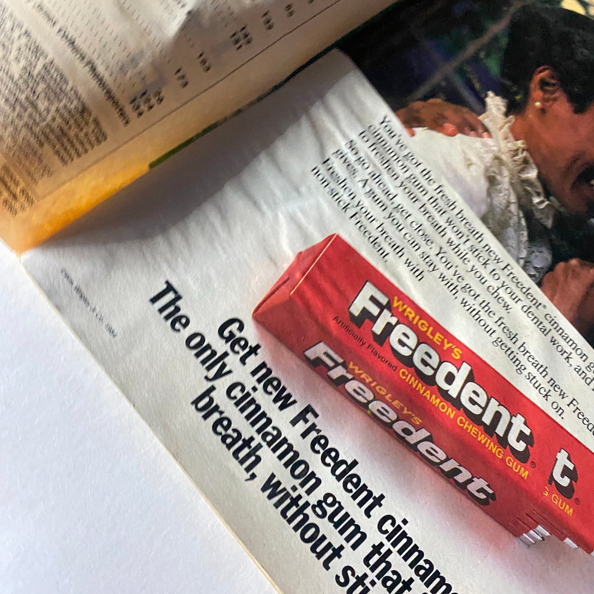 Close-up of an advertisement for Wrigley's Freedent cinnamon gum in the VTG Ebony Magazine May 1984, highlighting the unique features of the product and its promotional message.